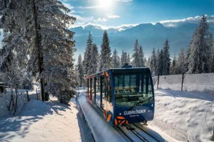 From Krakow: Zakopane Tour with Hotel Pickup & Thermal Baths - Krupowki Street and the taste of highland Zakopane