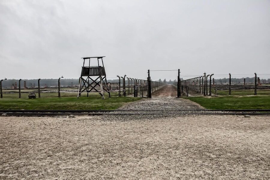 From Warsaw: Auschwitz-Birkenau Guided Tour with Fast Train - Auschwitz I: Barracks, Exhibits, and the Camp Entrance