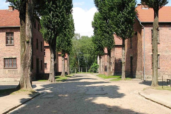 Guided Tour to Auschwitz Birkenau & Schindler Factory with PickUp - Entering Auschwitz I beneath Arbeit Macht Frei