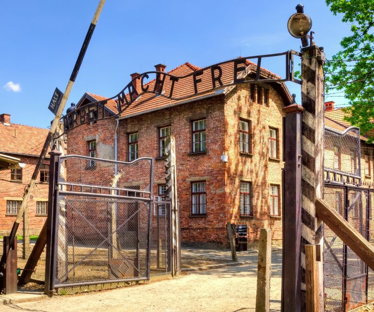Krakow: Auschwitz Guided Tour with Optional Hotel Pickup - Birkenau’s railway ramp and huge open scale