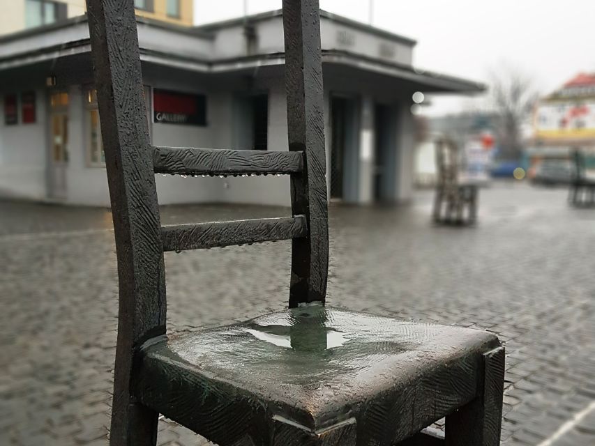 Krakow: Jewish Quarter and Former Ghetto Tour by Golf Cart - Ghetto Heroes Square and the empty chairs